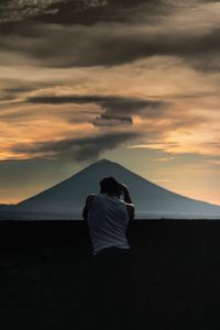 Preview wallpaper lonely, photographer, silhouette, mountain