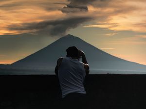 Preview wallpaper lonely, photographer, silhouette, mountain