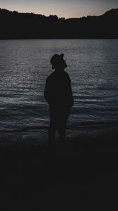 Preview wallpaper lonely, red, silhouette, hat