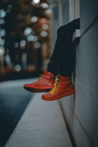 Preview wallpaper lonely, sneakers, red, legs, street