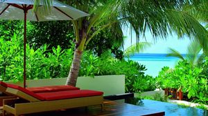 Preview wallpaper maldives, greens, vegetation, tropics, resort, chairs, palm trees, chaise lounge