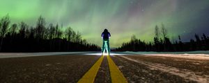 Preview wallpaper man, alone, backlight, road, northern lights