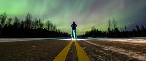 Preview wallpaper man, alone, backlight, road, northern lights