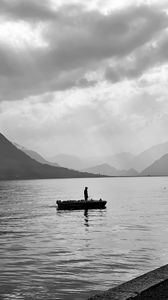 Preview wallpaper man, alone, boat, lake, black and white