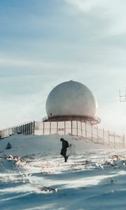 Preview wallpaper man, alone, building, ball, snow, winter, white