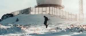 Preview wallpaper man, alone, building, ball, snow, winter, white