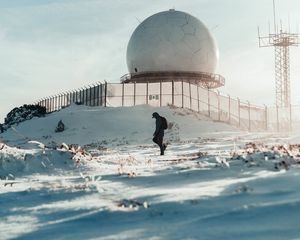 Preview wallpaper man, alone, building, ball, snow, winter, white