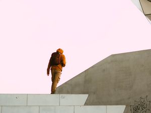 Preview wallpaper man, alone, building, minimalism