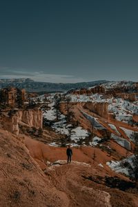 Preview wallpaper man, alone, canyon, rocks, snow