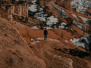 Preview wallpaper man, alone, canyon, rocks, snow