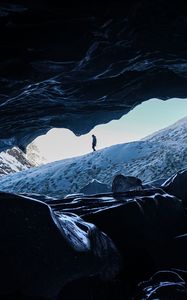 Preview wallpaper man, alone, cave, rocks, ice