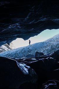 Preview wallpaper man, alone, cave, rocks, ice