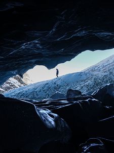 Preview wallpaper man, alone, cave, rocks, ice