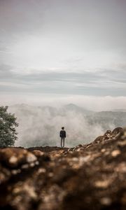 Preview wallpaper man, alone, cliff, mountains, fog