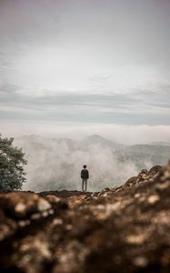 Preview wallpaper man, alone, cliff, mountains, fog