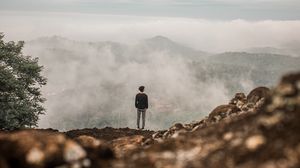 Preview wallpaper man, alone, cliff, mountains, fog