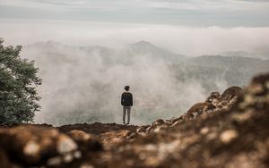 Preview wallpaper man, alone, cliff, mountains, fog