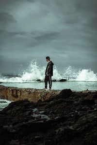 Preview wallpaper man, alone, coast, spray, water