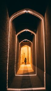 Preview wallpaper man, alone, corridor, light, architecture