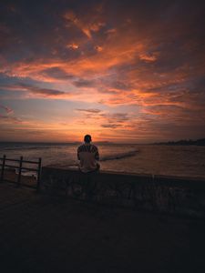 Preview wallpaper man, alone, embankment, water, sunset