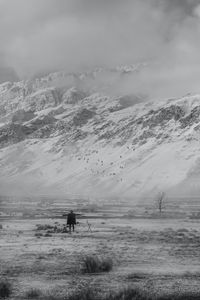 Preview wallpaper man, alone, freedom, gesture, mountains, snow, black and white