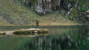 Preview wallpaper man, alone, lake, mountain, reflection