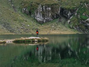 Preview wallpaper man, alone, lake, mountain, reflection
