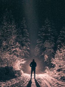 Preview wallpaper man, alone, light, snow, winter, forest, dark