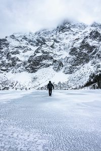 Preview wallpaper man, alone, loneliness, mountains, snow, winter