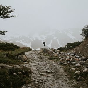 Preview wallpaper man, alone, mountains, road, fog