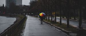 Preview wallpaper man, alone, rain, umbrella, embankment, city