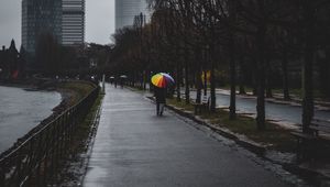 Preview wallpaper man, alone, rain, umbrella, embankment, city