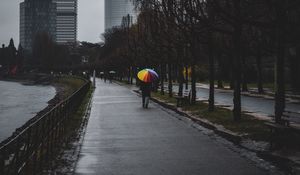 Preview wallpaper man, alone, rain, umbrella, embankment, city