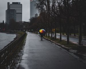 Preview wallpaper man, alone, rain, umbrella, embankment, city