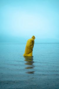 Preview wallpaper man, alone, raincoat, water, rain