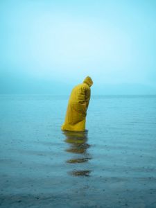 Preview wallpaper man, alone, raincoat, water, rain