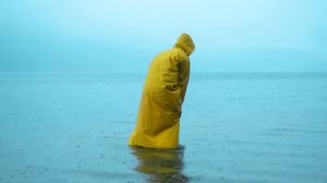Preview wallpaper man, alone, raincoat, water, rain