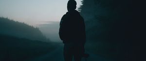 Preview wallpaper man, alone, road, fog, dusk, dark