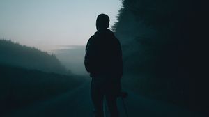 Preview wallpaper man, alone, road, fog, dusk, dark