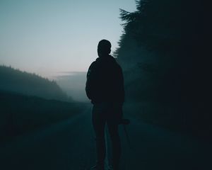 Preview wallpaper man, alone, road, fog, dusk, dark