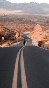 Preview wallpaper man, alone, road, desert, mountains