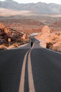 Preview wallpaper man, alone, road, desert, mountains