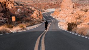 Preview wallpaper man, alone, road, desert, mountains