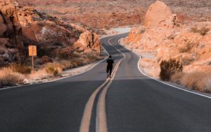 Preview wallpaper man, alone, road, desert, mountains