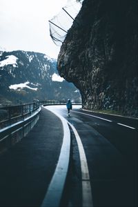 Preview wallpaper man, alone, road, turn, mountains