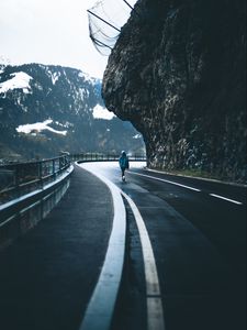 Preview wallpaper man, alone, road, turn, mountains
