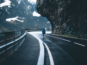 Preview wallpaper man, alone, road, turn, mountains