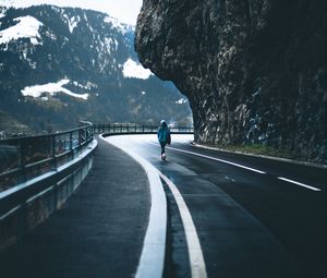 Preview wallpaper man, alone, road, turn, mountains