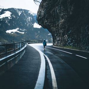 Preview wallpaper man, alone, road, turn, mountains