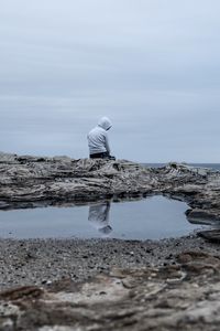 Preview wallpaper man, alone, sad, rock, sea